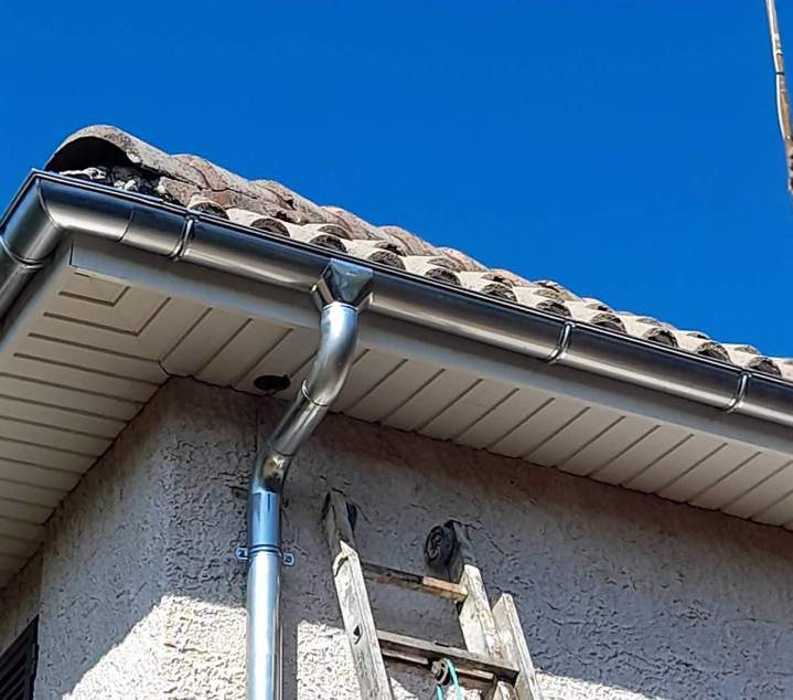 pose de gouttière Lot